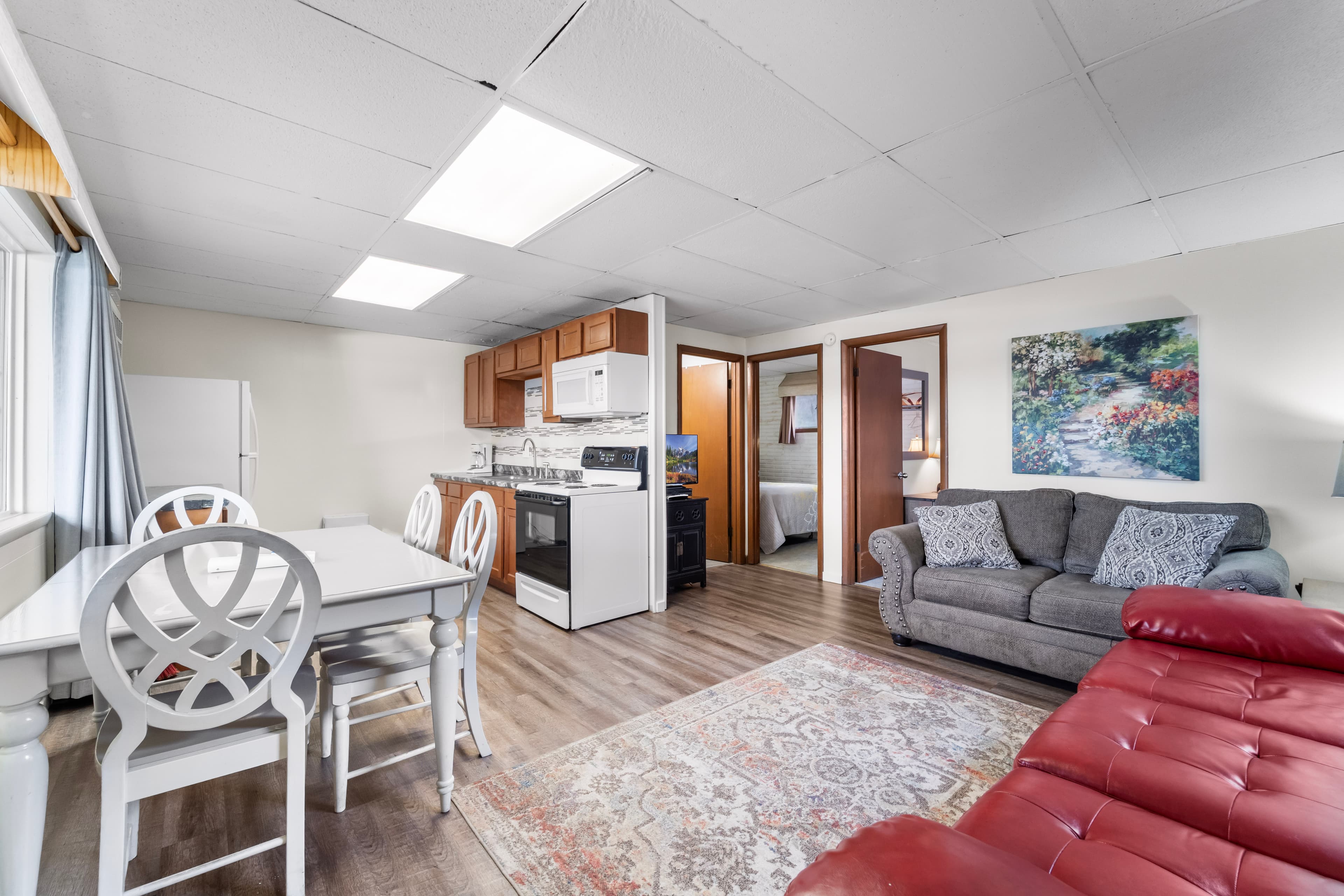 Cozy living space featuring a dining area, kitchen, and comfortable seating.