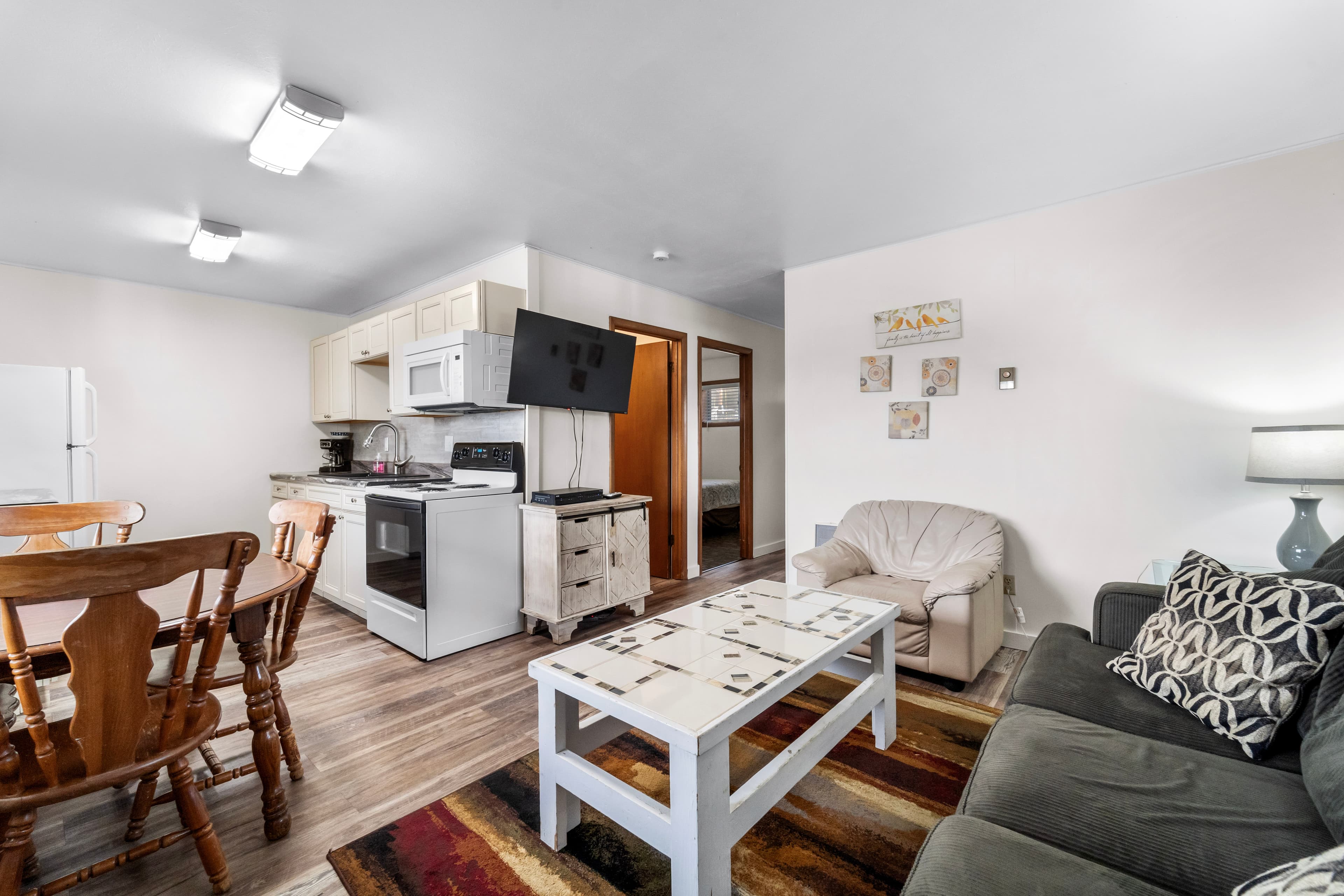 Cozy apartment interior featuring a kitchen, dining area, and living space.
